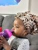 Kid size satin reversible bonnet